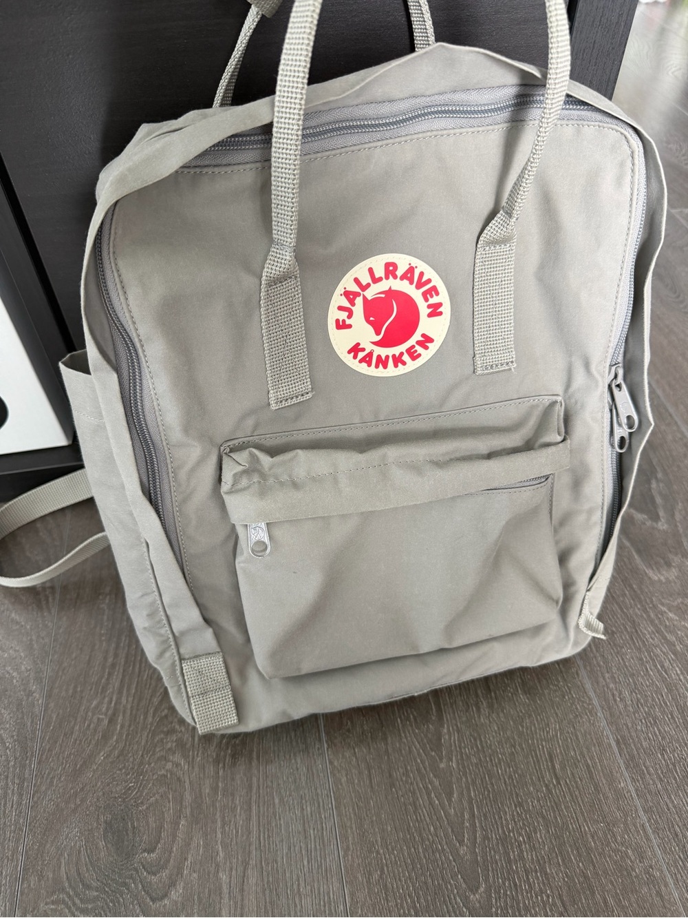 Fjallraven Kånken Backpack in Light Gray with Red Logo